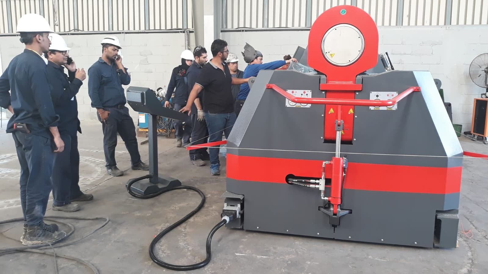 TAQNIA technical maintenance team working on industrial equipment